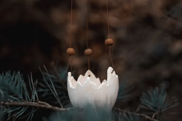 Picture of an Easter egg for magical Easter greetings: carried by branches