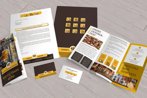 Voorbeelden van het huisstijlontwerp voor voeding en voedsel: flyer, briefpapier, visitekaartjes.