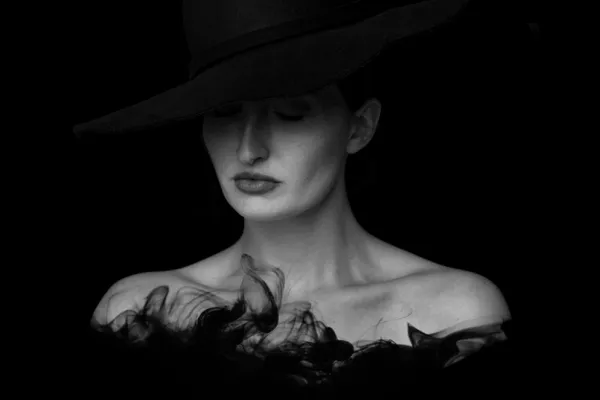 Black and white portrait of a woman into which a water texture has been incorporated.