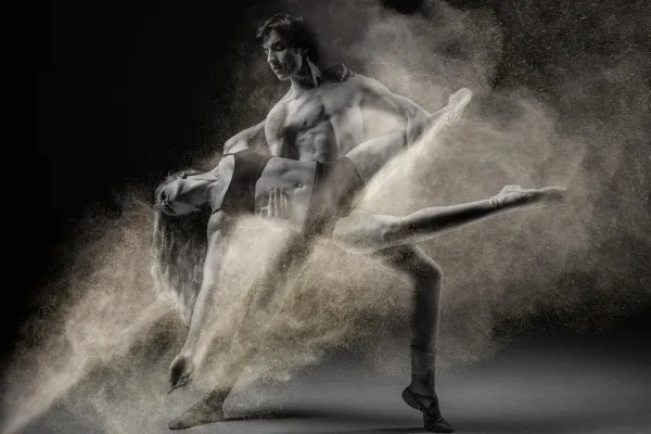 Dancing couple in black and white, photo was provided with a dust effect by means of texture.