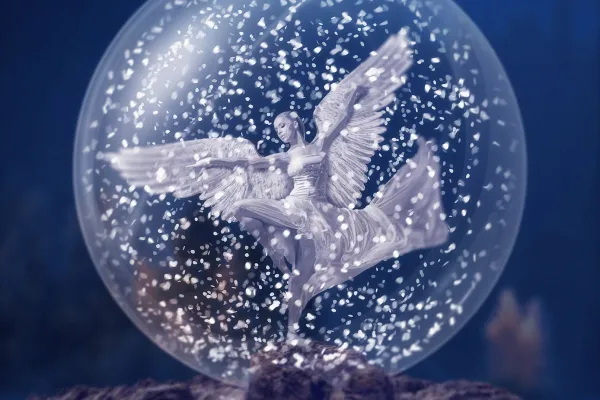 Composición de un ángel de Navidad en una bola de nieve, creada en el tutorial de Affinity Photo en alemán.