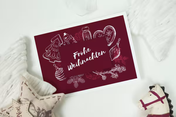 Tarjeta de Navidad con motivos navideños en blanco