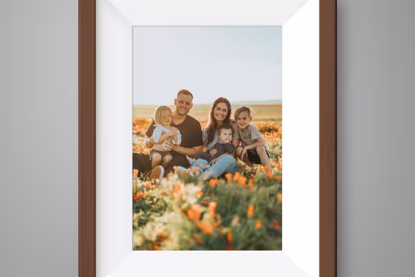 Family photo in a brown picture frame with wooden texture