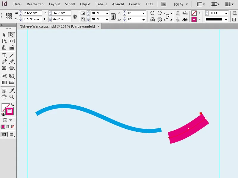 Use the scissors tool in Adobe InDesign
